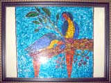 Glass painting of two parakeets on a tree
