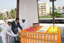 Dist. Collector laying wreath at Victory at Sea war memorial.